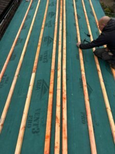 Roofing Contractor doing roof work.